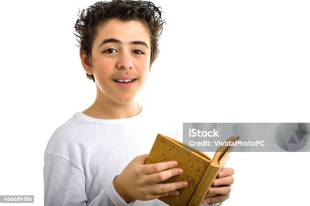 Cute Boy Reads Brown Cork Blank Book Smiling Stock Photo - Download Image Now - 2015, Beautiful People, Blank