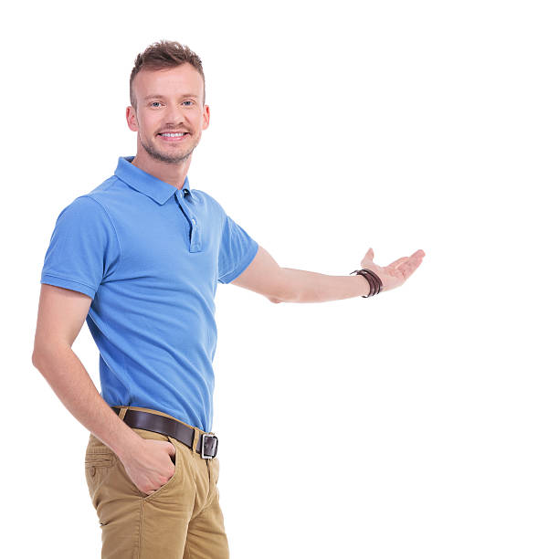 istock casual young man presents something 466684234