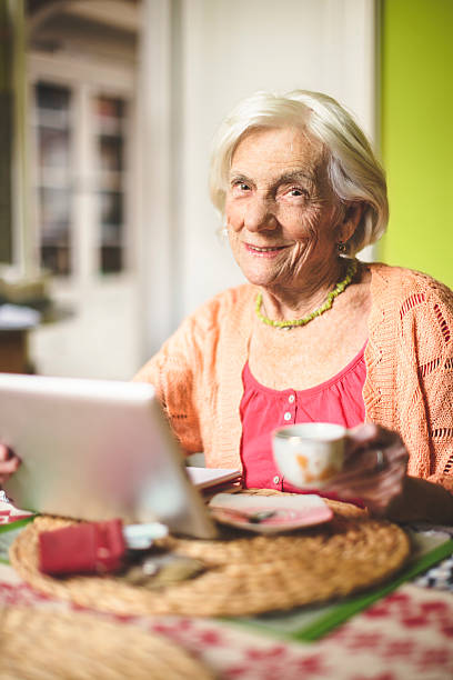 istock Senior woman calculating finances in her kitchen 466693025