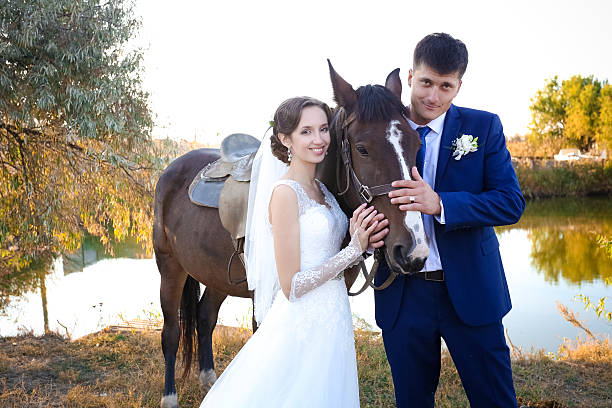 istock Young bride and groom in the stables on the wedding day 466694980