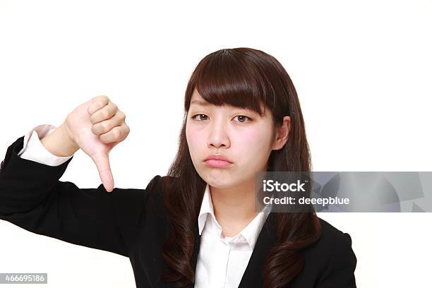 Businesswoman With Thumbs Down Gesture Stock Photo - Download Image Now - 20-29 Years, 2015, Adult