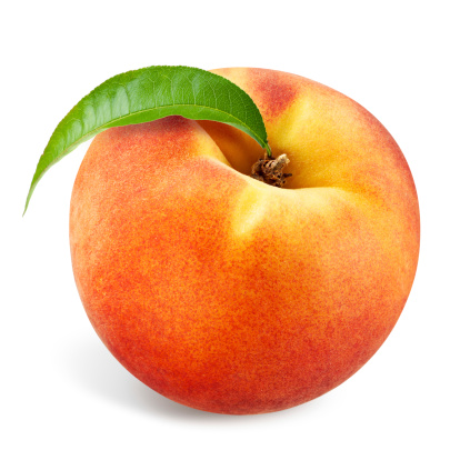 Peach with leaf isolated on white