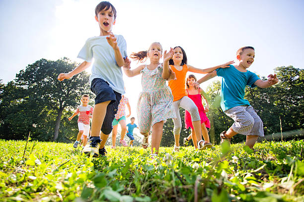 istock Low angle view of happy kids having fun in nature. 466697040