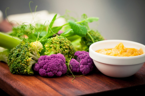 Fresh vegetables selection with hummus and dipping sauce