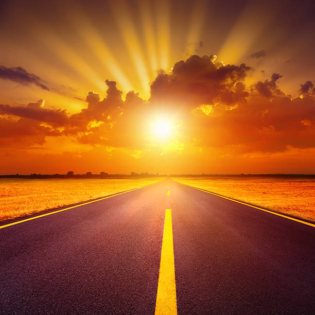 istock Driving on an empty asphalt road at sunset 466699383