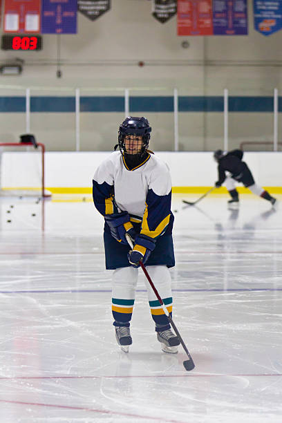 istock Female ice hockey player during a pre-game warm-up 466700101