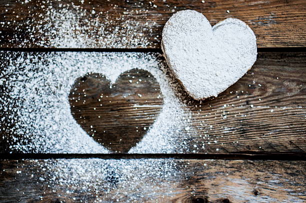istock Heart cookies with sugar powder on rustic wooden background 466702065