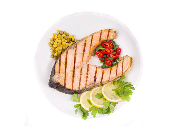 istock Grilled salmon steak with vegetables. 466703786