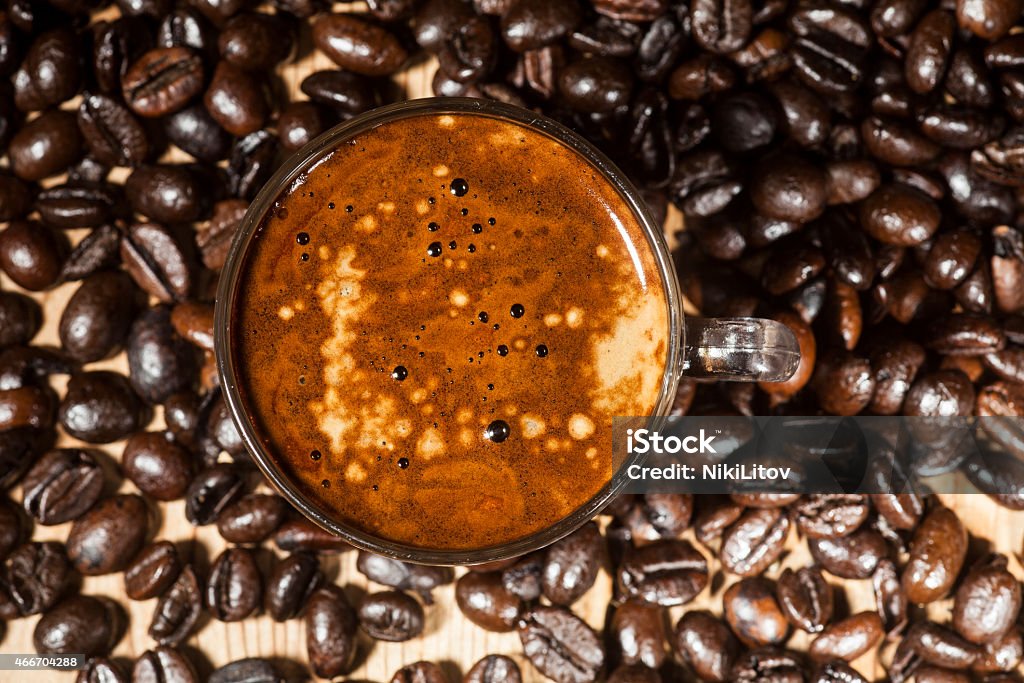Coffee Glass coffee cup and coffee beans on old wooden background. 2015 Stock Photo