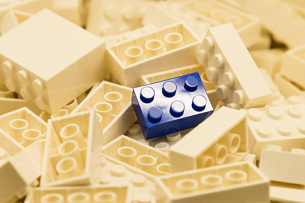 istock Pile of white building blocks with focus on blue block 466704578