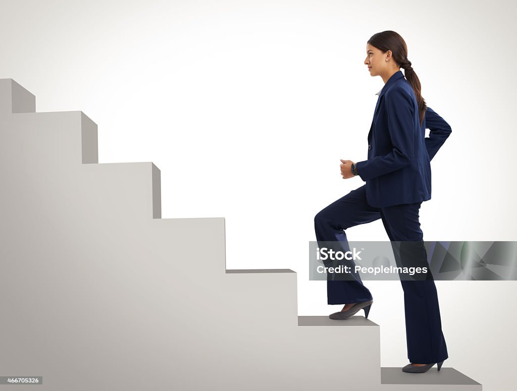 She won't stop still she gets to the top Studio shot of a motivated businesswoman climbing a flight of stairshttp://195.154.178.81/DATA/i_collage/pi/shoots/785299.jpg Staircase Stock Photo