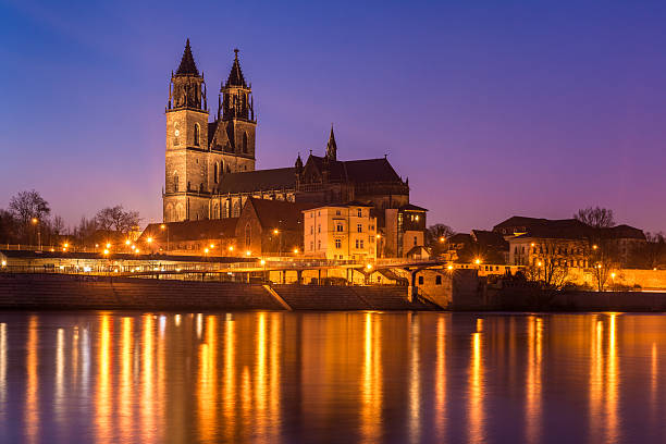 The historic dome of Magdeburg reflecting on river Elbe, Germany