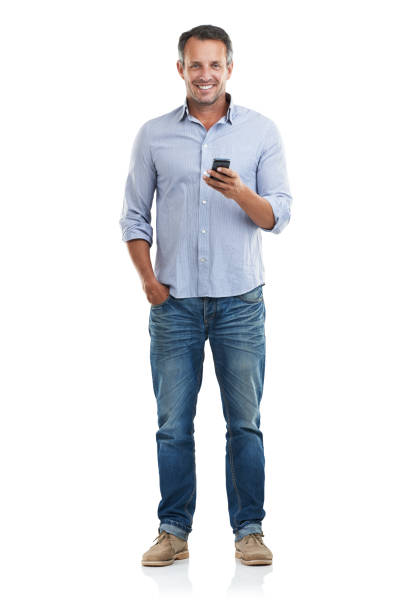 Downloading a new app is so easy Full length portrait of a handsome man checking his phone against a white backgroundhttp://195.154.178.81/DATA/i_collage/pu/shoots/785221.jpg one person standing stock pictures, royalty-free photos & images