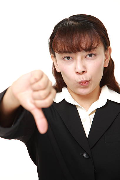 istock businesswoman with thumbs down gesture 466708828