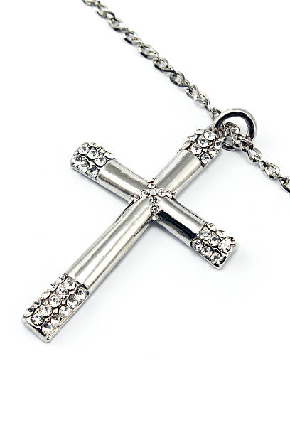 istock Silver christian cross with small diamonds isolated on white 466709073