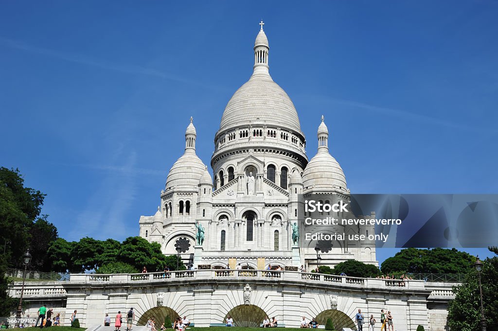 Sacré-Coeur Basilica in Paris Paris, France - August 17, 2012: Sacre-Coeur Basilica on a sunny day, plenty of tourist sitting and standing on the stairs for the beautiful architecture. 2015 Stock Photo