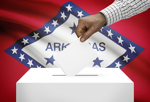 Voting concept - Ballot box with US state flag on background - Arkansas