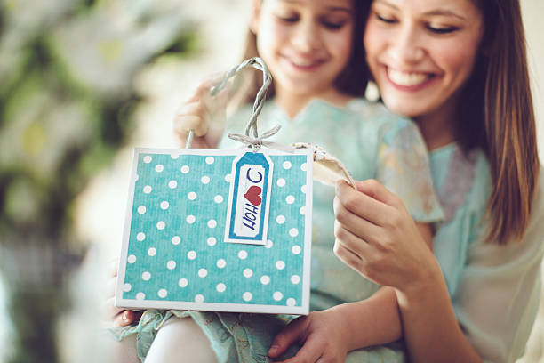 Mother getting a mother's day present from her daughter