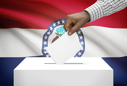 Voting concept - Ballot box with US state flag on background - Missouri
