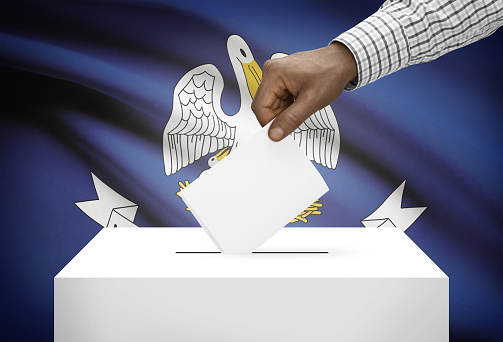 Voting concept - Ballot box with US state flag on background - Louisiana