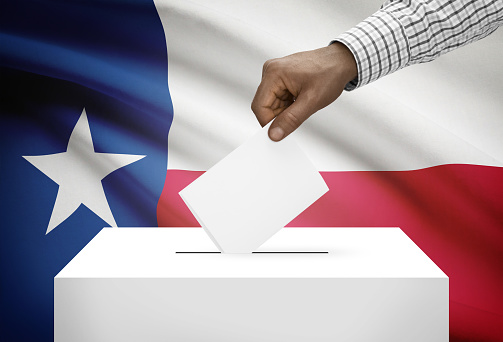 Voting concept - Ballot box with US state flag on background - Texas