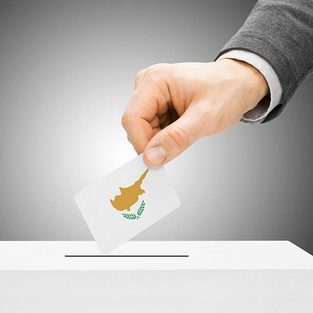 Voting - Male inserting flag into ballot box - Cyprus stock photo