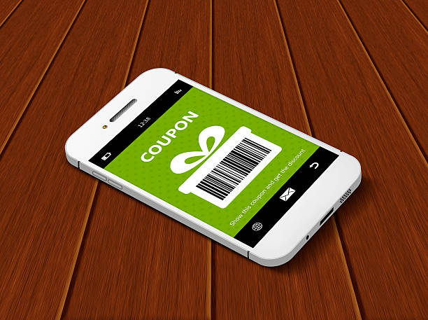 istock mobile phone with discount coupon lying on table 466713834