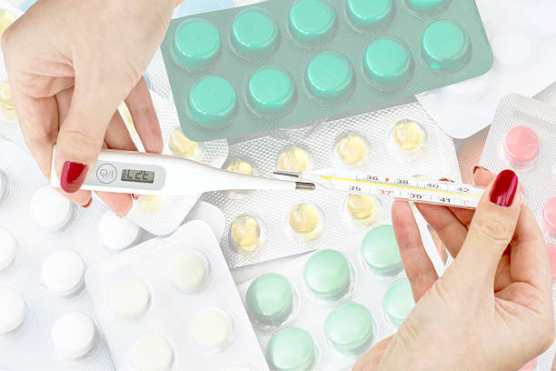 istock Different thermometer in the hands of doctors against the backdr 466714354
