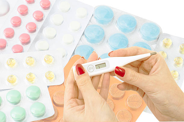 istock Electronic thermometer in the hands of doctors against the backd 466714364