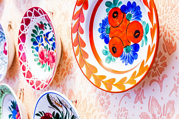 Vintage and antique souvenir plates on display at an antique shop