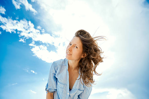 istock woman against blue sky 466717474