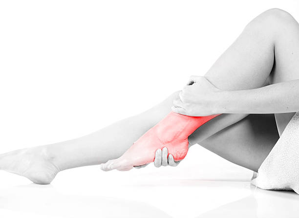 istock Woman massaging her painful ankle 466718286