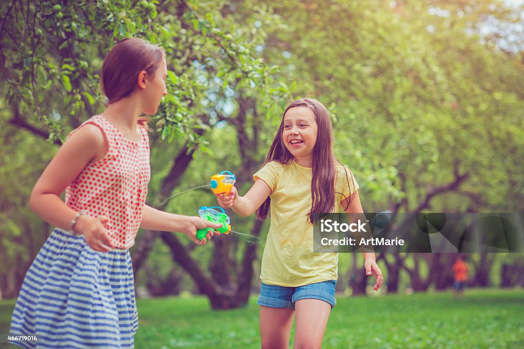 Children in park Two girls playing in a park Child Stock Photo