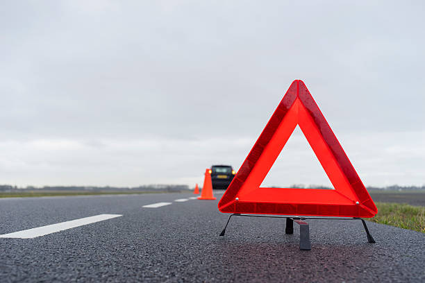 istock car with a breakdown in the rain and fog 466719677