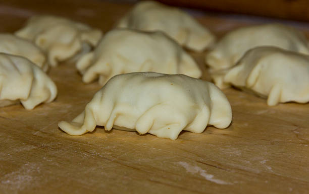 istock Homemade dumplings lying on a plank prepared for cooking 466720871