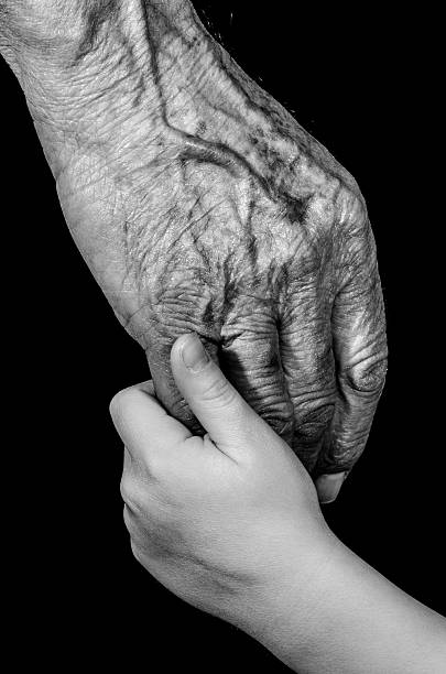 istock Young hand child holding old hand grandfather 466721379