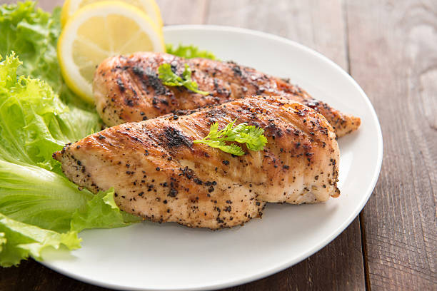 istock Marinated grilled chicken breasts cooked BBQ and served with fre 466724336