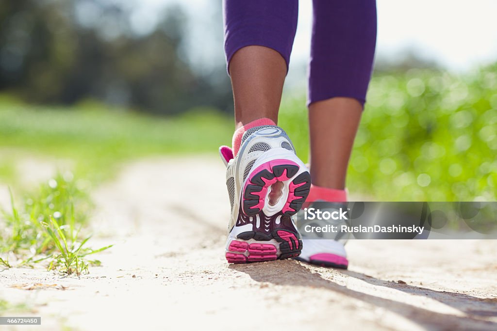 Athlete Running. feet of an athlete running at the park.  Walking Stock Photo