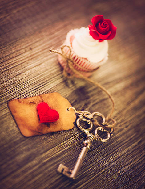 Two ornate antique keys are resting on a luxurious red velvet fabric, suggesting mystery, history, and secrecy