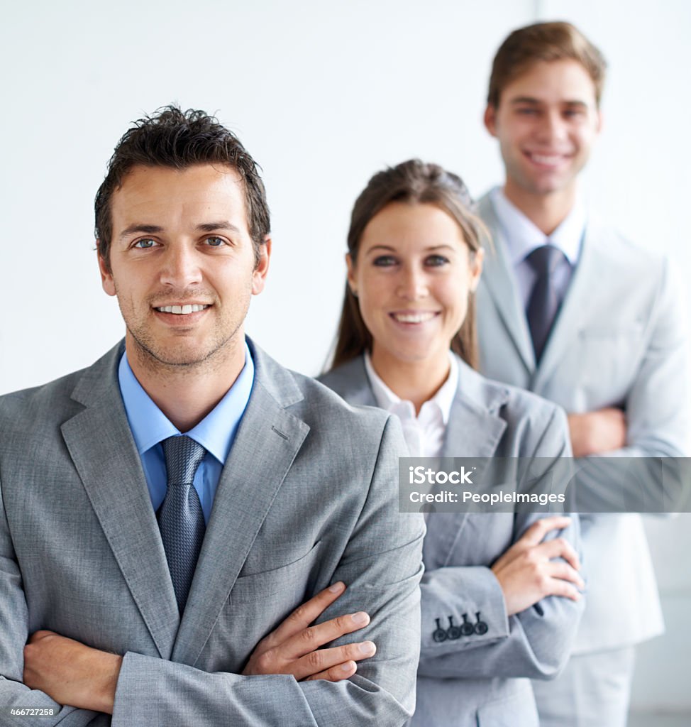 They stand behind their leader! Portrait of a group of smiling businesspeople standing in a linehttp://195.154.178.81/DATA/istock_collage/0/shoots/781776.jpg 2015 Stock Photo