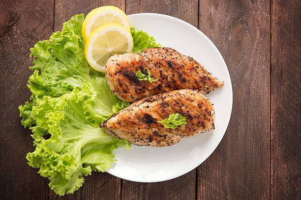 istock Marinated grilled chicken breasts cooked BBQ and served with fre 466734036