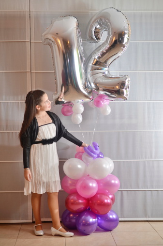 Secular 12-year-old Israeli teenager celebrating her Bat Mitzvah with special balloons