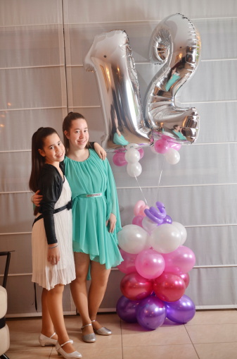 Secular 12-year-old Israeli teenager celebrating her Bat Mitzvah with her older sister