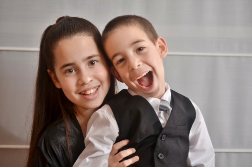 Secular 12-year-old Israeli teenager celebrating her Bat Mitzvah with her younger brother