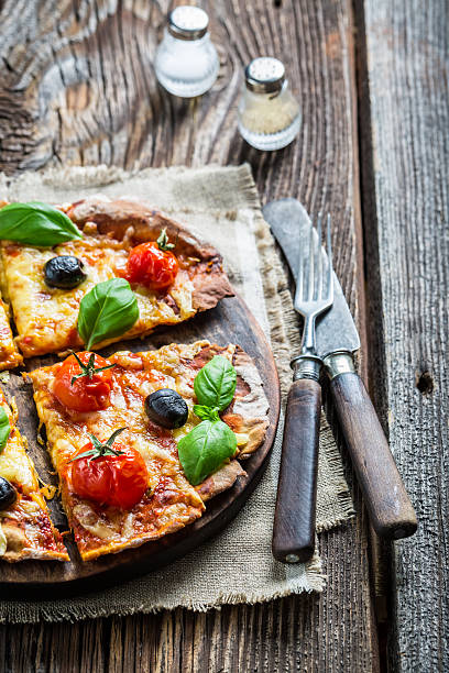 istock Homemade pizza with mushrooms on baking paper 466738296