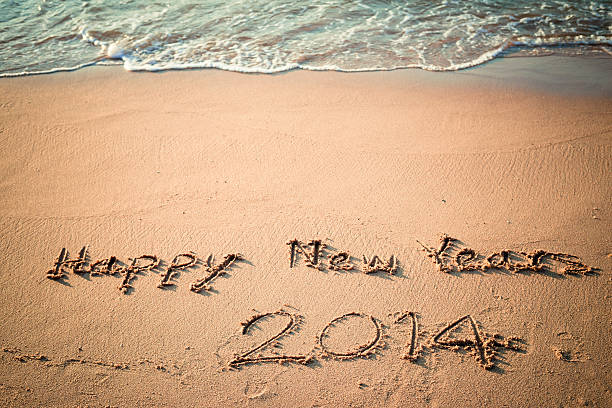 istock Writing Happy New Year's 2014 on the Beach in Thailand 466741481