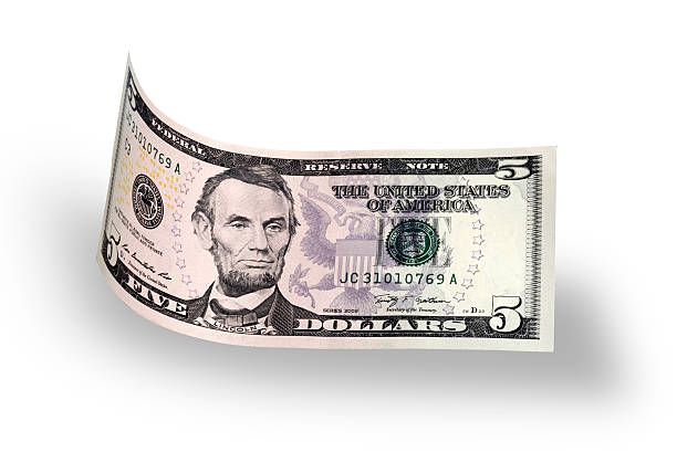istock Curled Five American Dollar Bill Falls on White Background 466741876