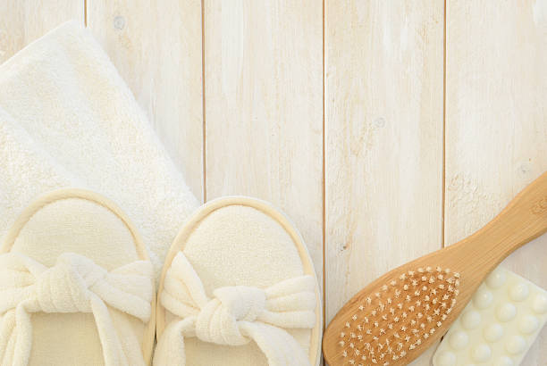 istock Bath slippers, towel,soap and brush on planks 466742218