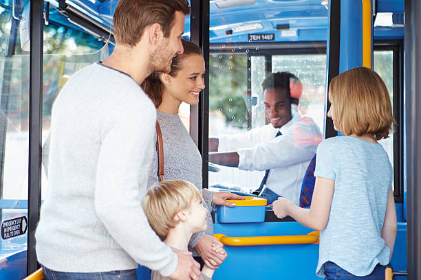 istock Family Boarding Bus And Buying Ticket 466742621