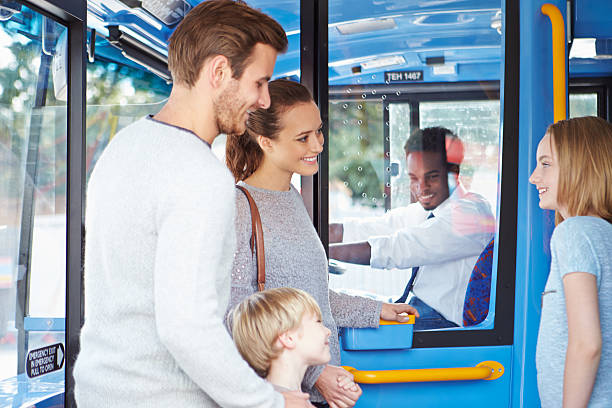 istock Family Boarding Bus And Buying Ticket 466742633